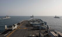 ARABIAN SEA (March 19, 2021) – U.S. Navy Ticonderoga-class cruiser USS Port Royal (CG 73), left, French Navy aircraft carrier FS Charles de Gaulle (R 91), center, Japanese Maritime Self-Defense Force destroyer JS Ariake (DD 109), right, and the amphibious assault ship USS Makin Island (LHD 8) transit the Arabian Sea in support of Gulf Arabian Sea Warfare Exercise (GASWEX) 21. GASWEX 21 is a multilateral maritime exercise in the Arabian Sea and Gulf of Oman, with France, Belgium, Japan, and U.S., which provides a unique opportunity for participating forces to enhance mutual interoperability and capabilities in maritime security, anti-air warfare, anti-surface warfare, and anti-submarine warfare operations, allowing participating naval forces to effectively develop the necessary skills to address threats to regional security, freedom of navigation and the free flow of commerce. (U.S. Navy photo by Mass Communication Specialist 3rd Class Ethan Jaymes Morrow)
