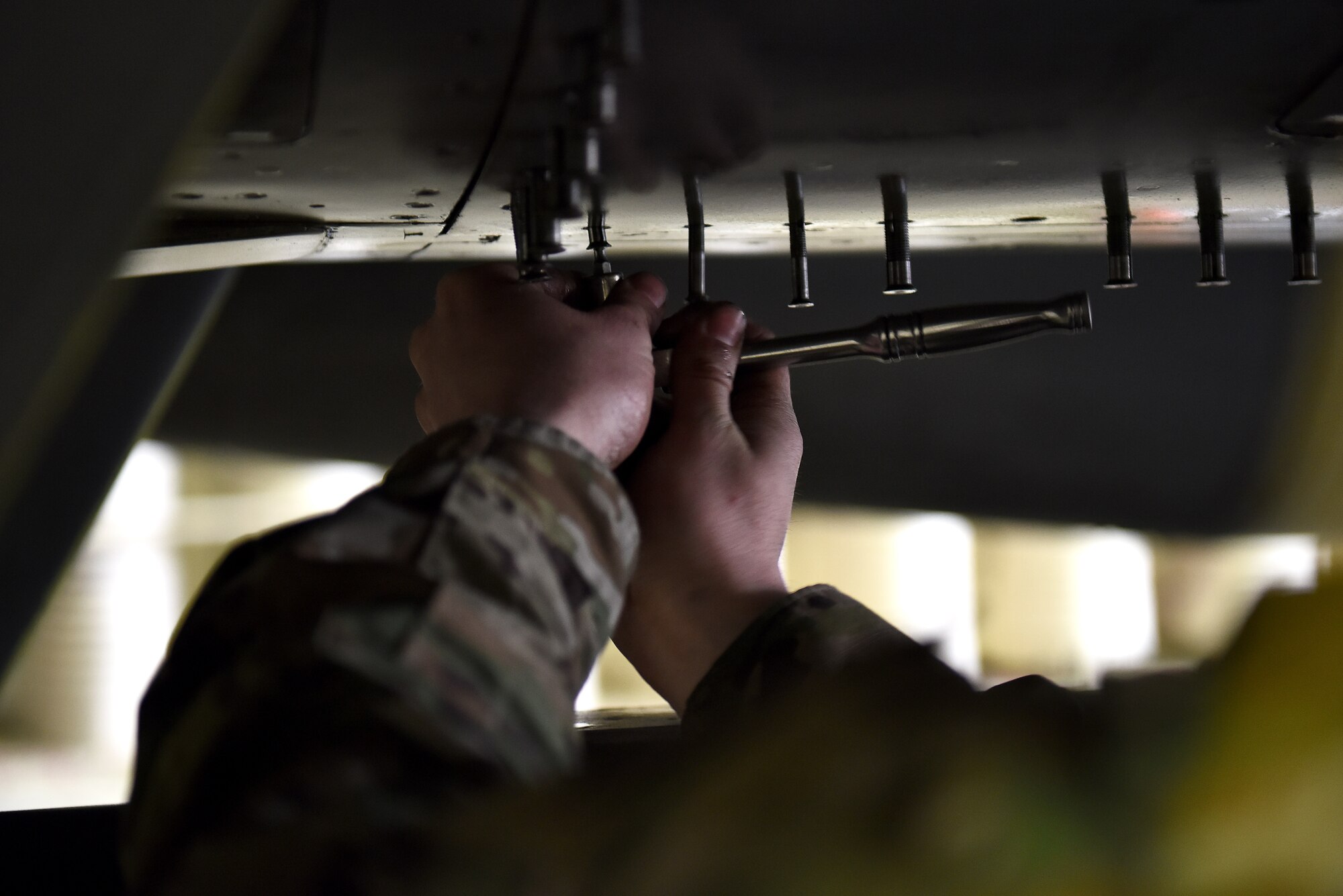 Staff Sgt. Ashley Mounts, 8th Aircraft Maintenance Squadron dedicated crew chief, tacks a panel on an F-16 Fighting Falcon for an engine run at Kunsan Air Base, Republic of Korea, March 21, 2021. Crew chiefs inspect, service, clean, and fix aircraft to ensure mission readiness. (U.S. Air Force photo by Senior Airman Suzie Plotnikov)