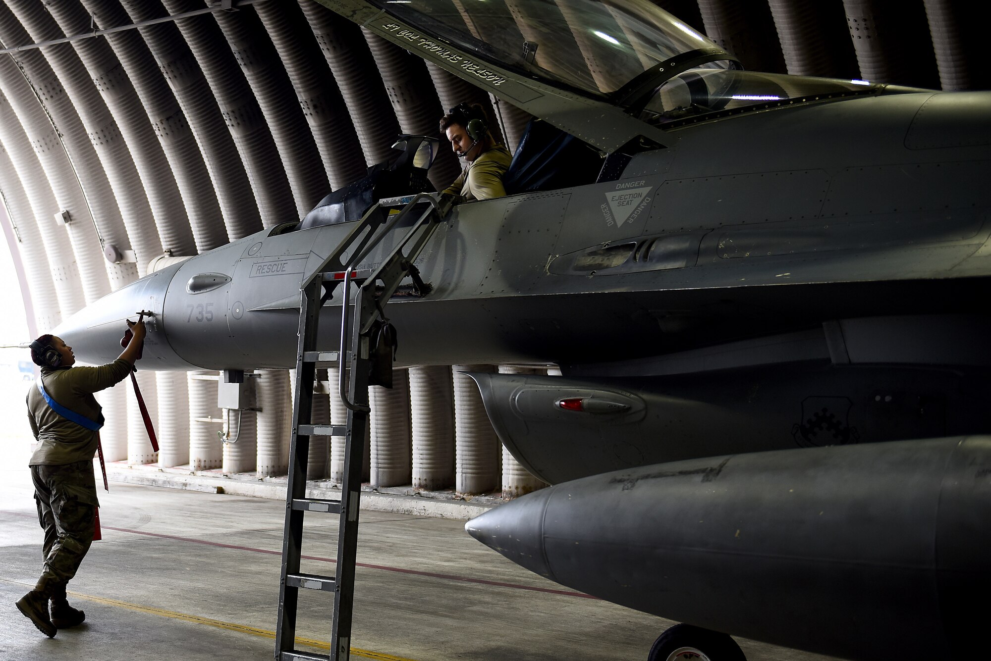 Senior Airman Marirosa Padilla-Tung, 8th Aircraft Maintenance Squadron crew chief, and Staff Sgt. Ashley Mounts, 8th AMXS dedicated crew chief, perform a post-flight inspection on an F-16 Fighting Falcon at Kunsan Air Base, Republic of Korea, March 21, 2021. Crew chiefs inspect, service, clean, and fix aircraft to ensure mission readiness. (U.S. Air Force photo by Senior Airman Suzie Plotnikov)