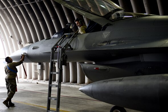 Senior Airman Marirosa Padilla-Tung, 8th Aircraft Maintenance Squadron crew chief, and Staff Sgt. Ashley Mounts, 8th AMXS dedicated crew chief, perform a post-flight inspection on an F-16 Fighting Falcon at Kunsan Air Base, Republic of Korea, March 21, 2021. Crew chiefs inspect, service, clean, and fix aircraft to ensure mission readiness. (U.S. Air Force photo by Senior Airman Suzie Plotnikov)