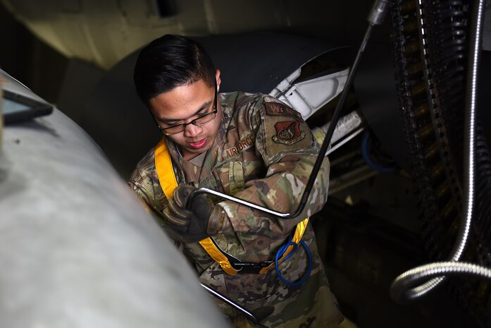 Senior Airman Jerome Fernandez, 8th Aircraft Maintenance Squadron weapons crew member, loads munitions on an F-16 Fighting Falcon at Kunsan Air Base, Republic of Korea, March 21, 2021. The F-16 is a compact, multi-role fighter aircraft that is highly maneuverable in air-to-air combat and air-to-surface attack.  (U.S. Air Force photo by Senior Airman Suzie Plotnikov)