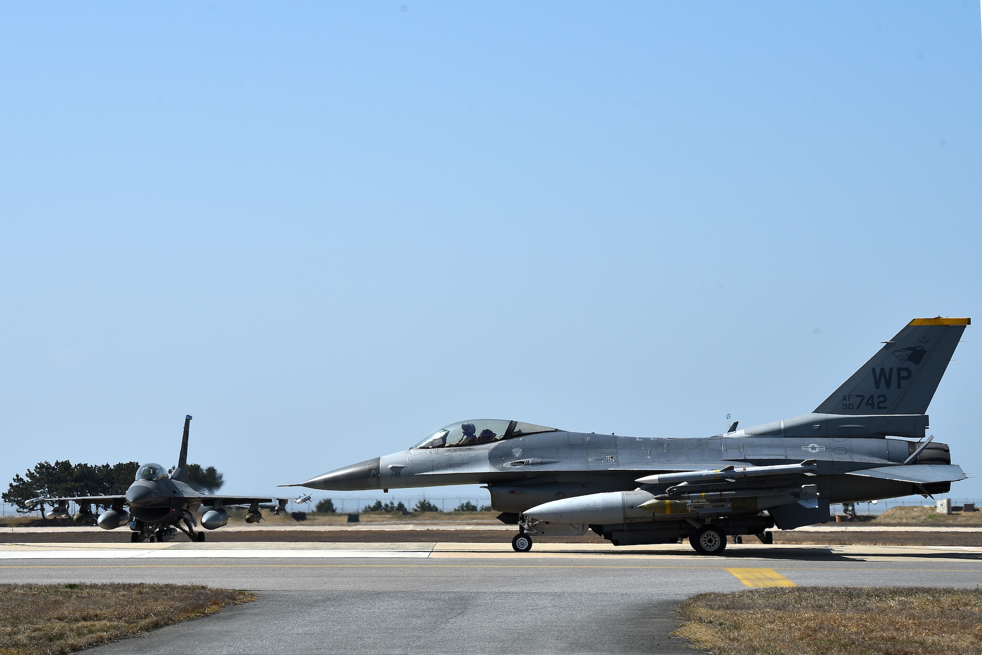 An F-16 Fighting Falcon taxis on the flightline at Kunsan Air Base, Republic of Korea, March 22, 2021. The F-16 Fighting Falcon is a compact, multi-role fighter aircraft that is highly maneuverable in air-to-air combat and air-to-surface attack. (U.S. Air Force photo by Senior Airman Suzie Plotnikov