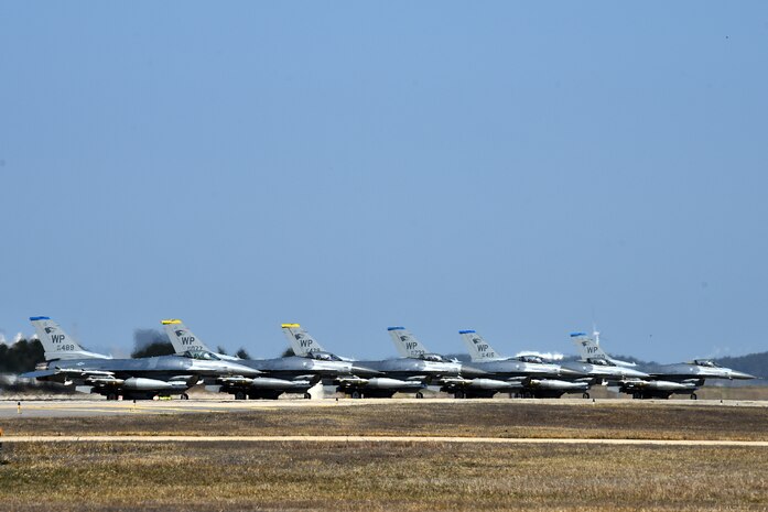 F-16 Fighting Falcons from the 35th Fighter Squadron “Pantons” and 80th Fighter Squadron “Juvats” park on the flightline at Kunsan Air Base, Republic of Korea, March 22, 2021. The F-16 Fighting Falcon is a compact, multi-role fighter aircraft that is highly maneuverable in air-to-air combat and air-to-surface attack. (U.S. Air Force photo by Senior Airman Suzie Plotnikov)