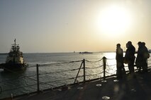 Sailors assigned to guided-missile cruiser USS Philippine Sea (CG 58) prepare to depart Manama, Bahrain, during a sea and anchor detail, March 21. Philippine Sea is deployed to the U.S.  5th Fleet area of operations in support of naval operations to ensure maritime stability and security in the Central Region, connecting the Mediterranean and Pacific through the western Indian Ocean and three critical chokepoints to the free flow of global commerce.