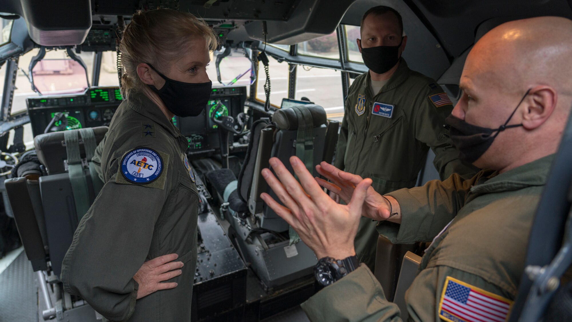 Maj. Gen. Jeannie M. Leavitt, director of operations and communications for the Air and Education Training Command at Joint Base San Antonio-Randolph, Texas, learns about the 53rd Weather Reconnaissance Squadron "Hurricane Hunters" from Capt. Peyton Eustis (center), pilot for the 53rd WRS, and Master Sgt. Ed Scherzer (right), loadmaster for the 53rd WRS, during a visit at Keesler Air Force Base, Miss., March 19, 2021. After joining the Air Force in 1992, Leavitt became the branch's first female fighter pilot in 1993. She visited the 81st Training Wing and the Air Force Reserve's 403rd Wing, and she spoke to members of Team Keesler during an event recognizing International Women's History Month. (U.S. Air Force photo by Staff Sgt. Kristen Pittman)