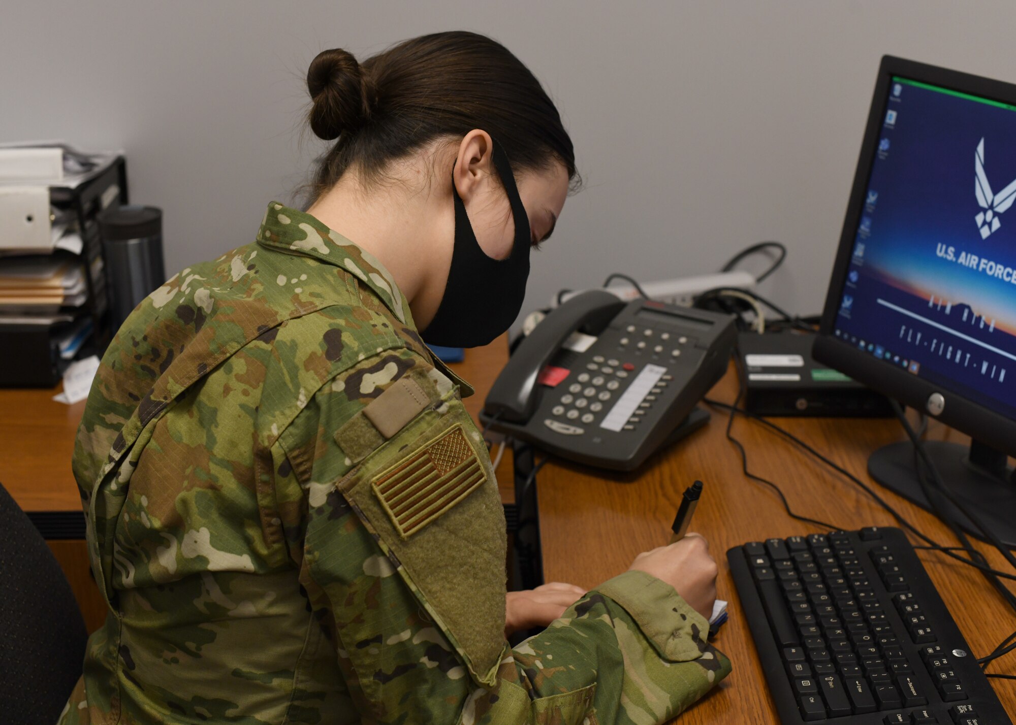 Senior Airman Weronika Baczek, public health technician, 104th Medical Group, takes down notes about a patient, in her office at Barnes Air National Guard Base, Massachusetts, Feb. 17, 2021. Contact tracing is critical for safeguarding 104th Fighter Wing mission readiness and the health of our Barnestormers and surrounding communities from COVID-19. (U.S. Air National Guard courtesy photo)