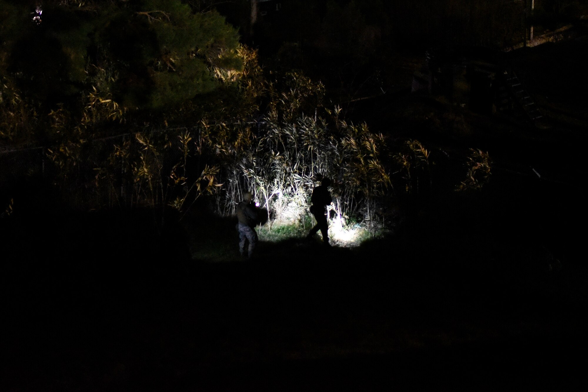 Security Forces Airmen patrol a base perimeter.