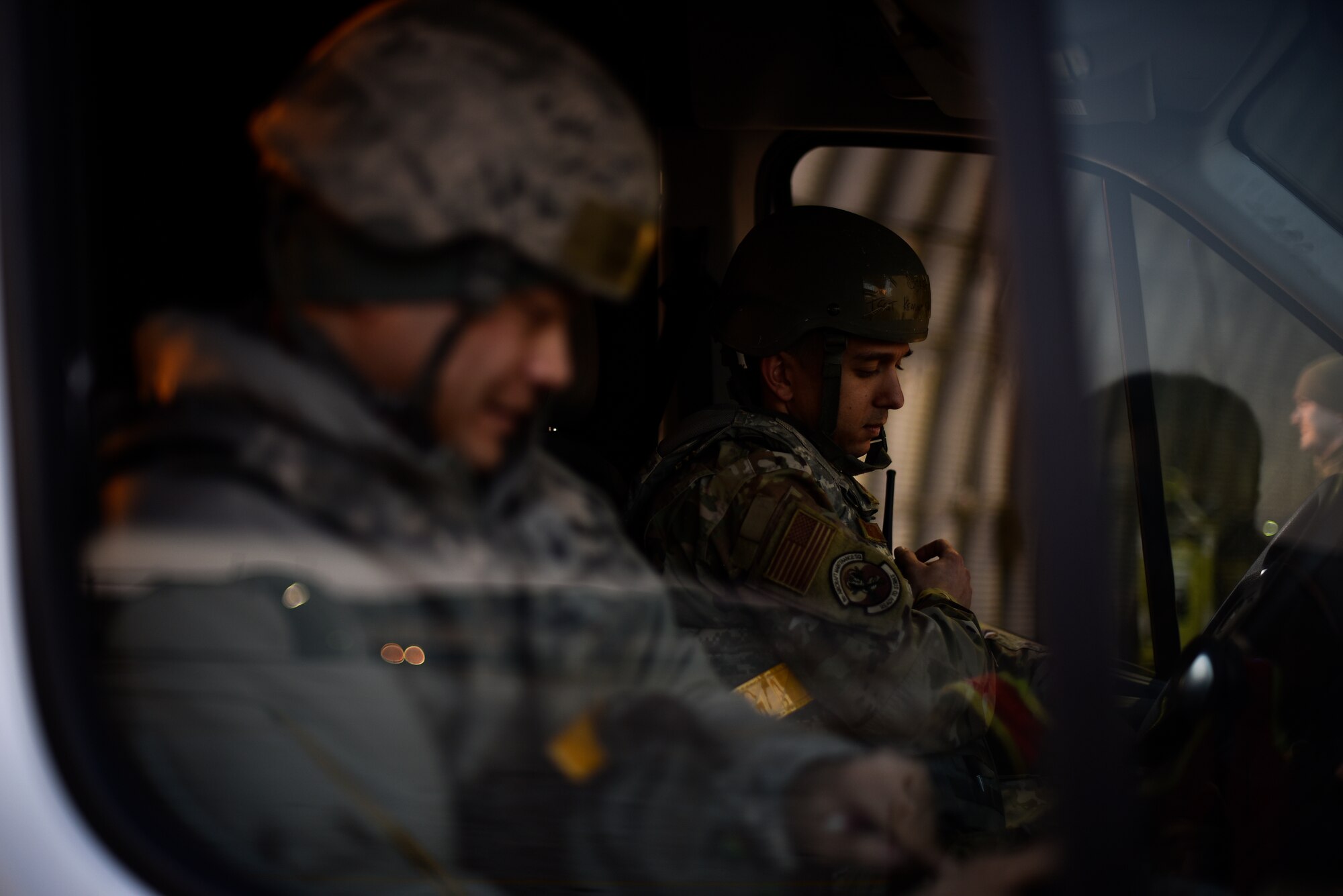 Maintenance leaders wait to pick up Airmen during shift changeover.