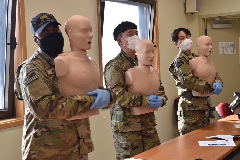 U.S. Army Corps of Engineers, Far East District, Emergency Essential Civilian (EEC) personnel and Mission Essential Civilian (MEC) personnel, practice first-aid techniques during the district's EEC training held at the Vehicle Maintenance Facility Mar 9.
