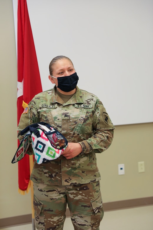 Sgt. Teresa Gonzalez, S1 NCOIC for the 1st Civil Affairs and Psychological Operations Training Brigade, thanks her colleagues and coworkers for their support of her after she was recognized by the Ft. Bragg USO as one of thirty female servicemembers across Ft. Bragg to be honored during Women’s History month.