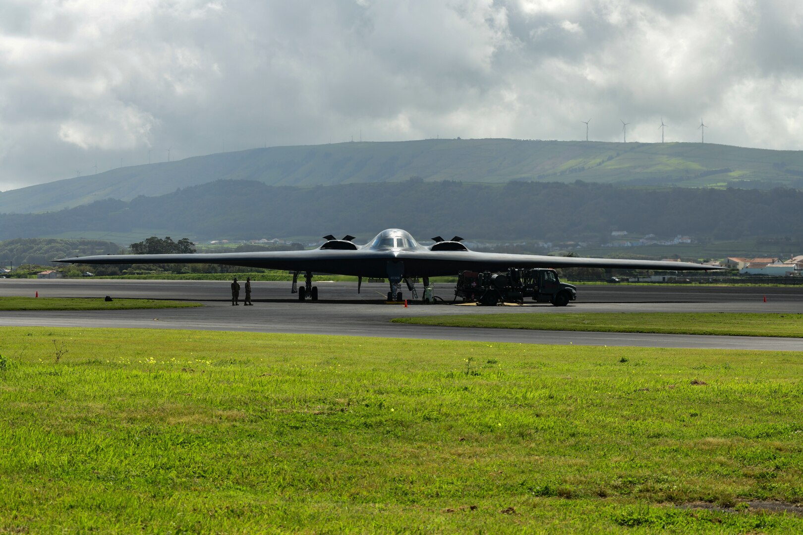 A B-2 Spirit, assigned to Whiteman Air Force Base, Missouri, hot-pit refuels at Lajes Field, Azores, March 19, 2021. The bomber supported a Bomber Task Force mission during which it integrated Norwegian F-35s in the High North. U.S. Global Strike Command Airmen and assets routinely operate across the globe and are flexible to respond to changes in the operational environment.