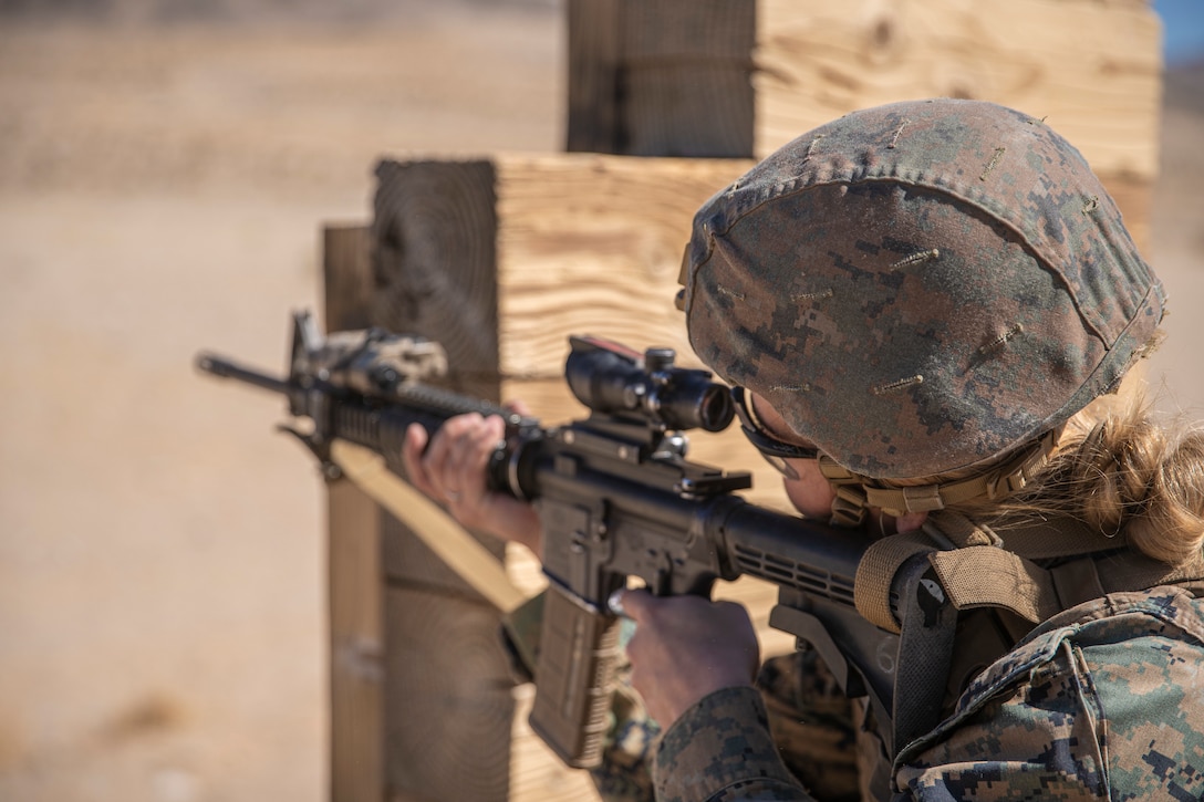 A U.S. Marine with Combat Logistics Battalion 11, 11th Marine Expeditionary Unit, fires a M4 carbine at targets during an unknown distance range as part of Realistic Urban Training exercise at Marine Corps Air Ground Combat Center Twentynine Palms, California, Feb. 25, 2021. RUT is the final shore-based predeployment training exercise for the 11th MEU, and provides an opportunity to plan and execute operations as a Marine Air-Ground Task Force in urban environments. (U.S. Marine Corps Photo by Cpl. Jaxson Fryar)