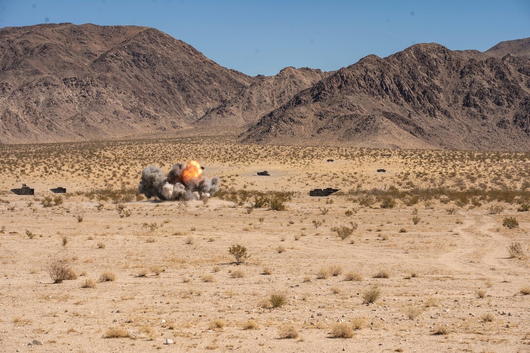 Explosive Ordnance Disposal Marines with Combat Logistics Battalion, 11th Marine Expeditionary Unit, detonate demolition during a surface munition disruption range as part of Realistic Urban Training exercise at Marine Corps Air Ground Combat Center Twentynine Palms, California, Mar. 1, 2021. RUT is the final shore-based predeployment training exercise for the 11th MEU, and provides an opportunity to plan and execute operations as a Marine Air-Ground Task Force in urban environments. (U.S. Marine Corps Photo by Cpl. Jaxson Fryar)