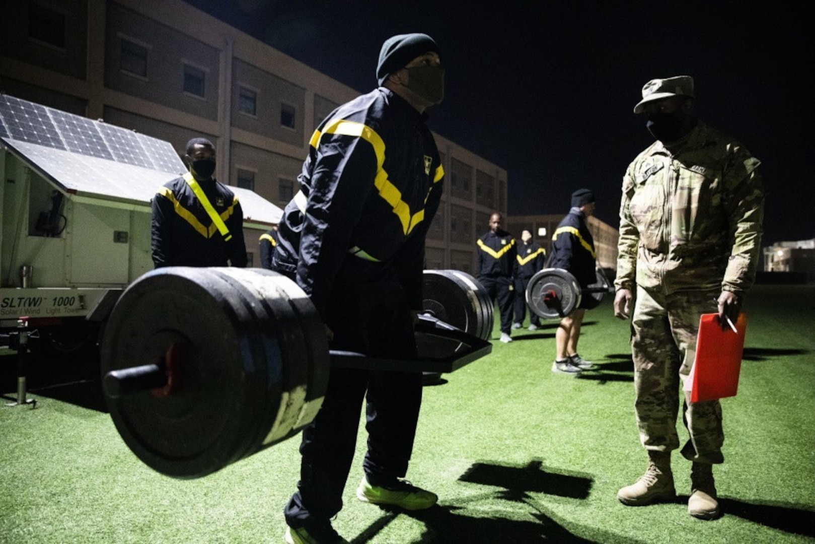 Maj. Mark Douglass, assigned to U.S. Army Central Forward at Camp Arifjan, Kuwait, deadlifts 340 pounds for maximum points in the event during an Army Combat Fitness Test Jan. 25, 2021.