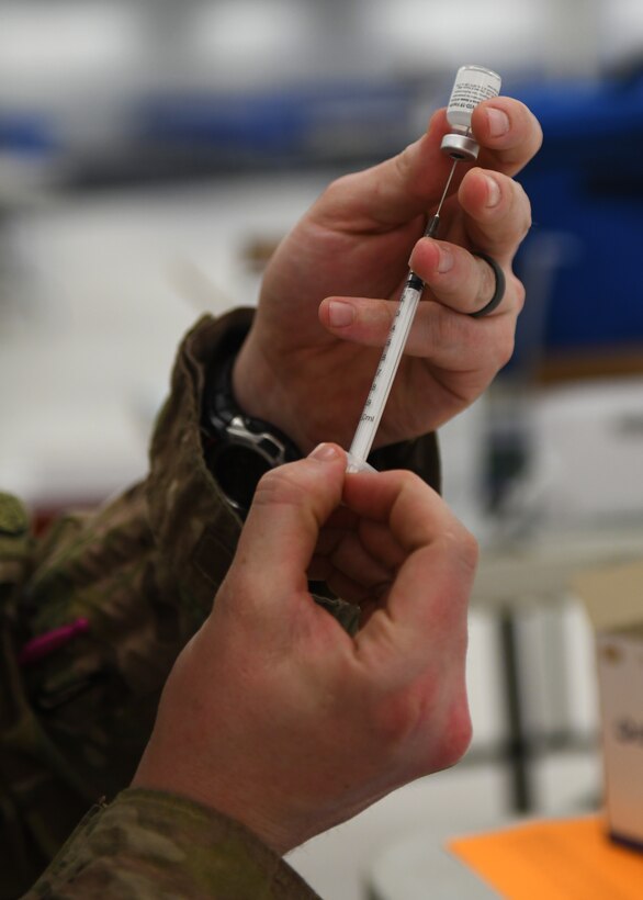 Not today COVID: Volunteers help administer vaccines to base community