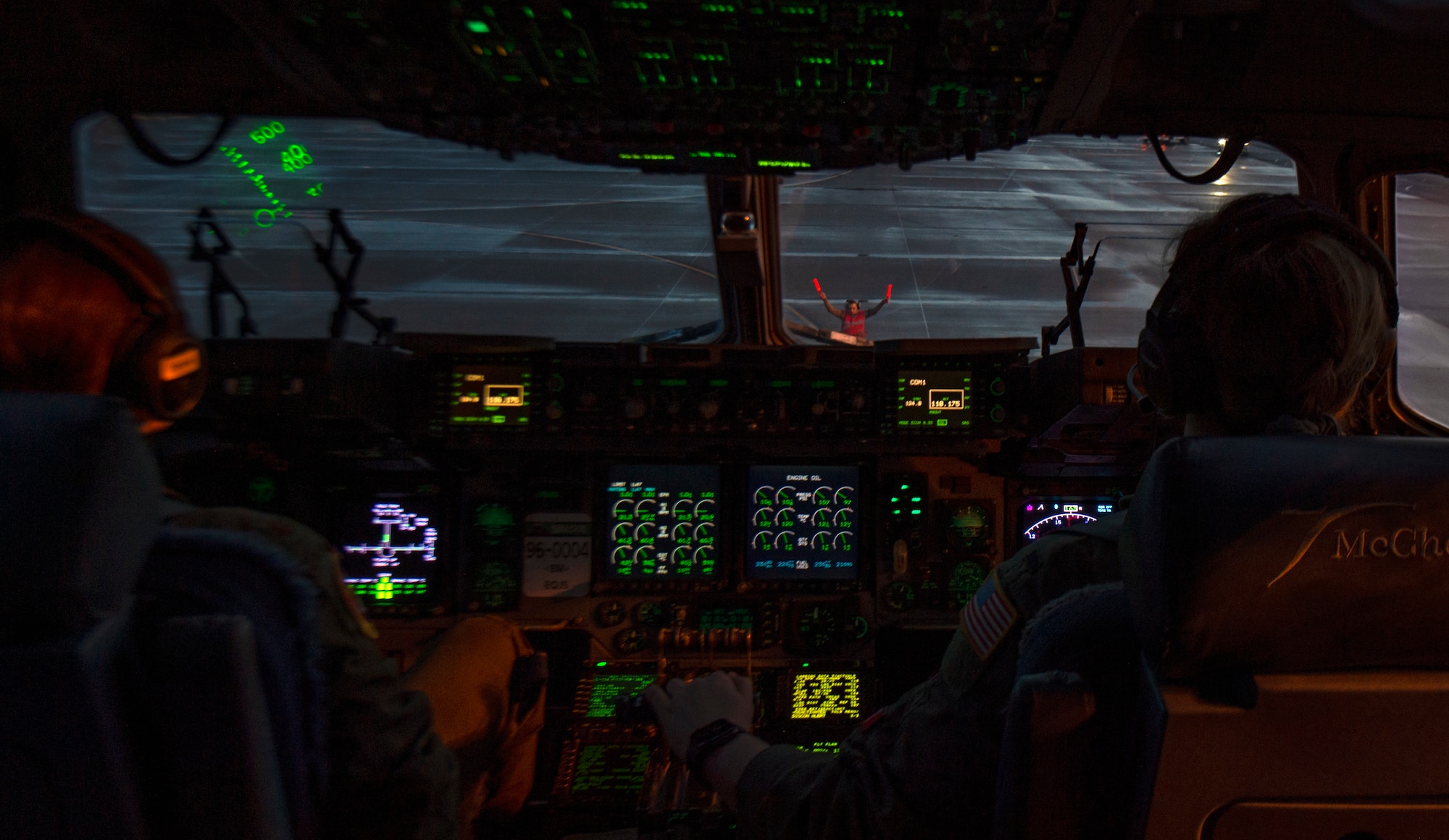 U.S. Air Force Maj. Celine Ziobro, 7th Airlift Squadron C-17 Globemaster III instructor pilot, taxis a C-17 Globemaster III to a parking spot after completing a training flight at Joint Base Lewis-McChord, Washington, Dec. 14, 2020. Every Airman involved in the preparation, launch and execution of the mission was female to honor women in the Air Force.  (U.S. Air Force photo by Senior Airman Tryphena Mayhugh)