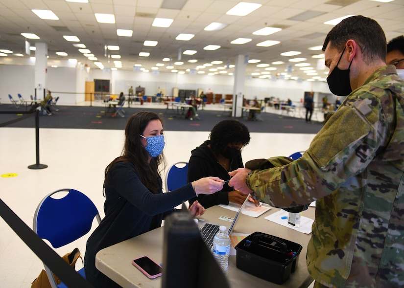 Not today COVID: Volunteers help administer vaccines to base community