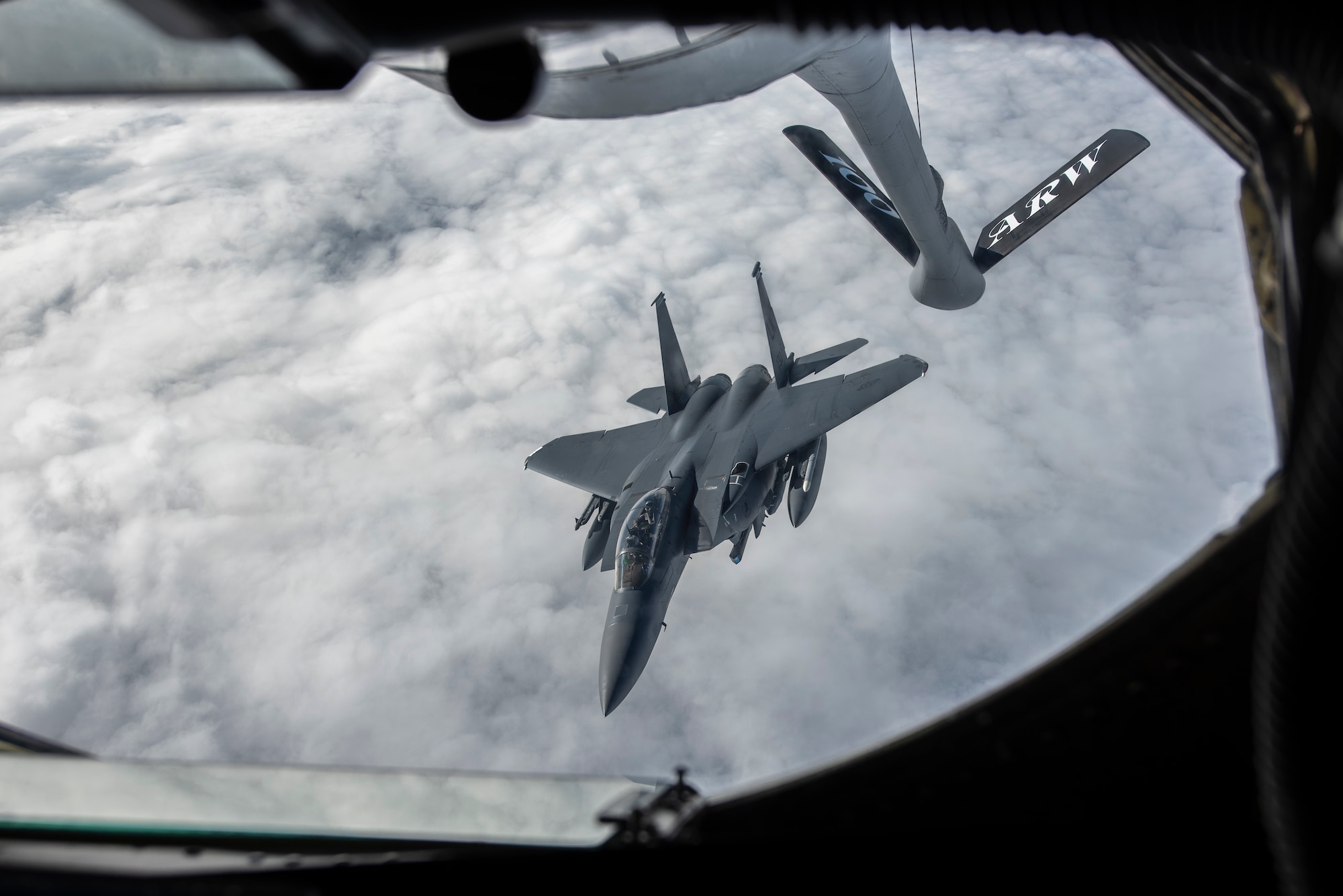 A 48th Fighter Wing F-15E Strike Eagle prepares to connect with a KC-135 Stratotanker for aerial refueling on the way to Amari Air Base, Estonia, in support of Exercise Baltic Trident, March 15, 2021. Incorporating Agile Combat Employment concepts into exercises like Baltic Trident increases lethality and enhances interoperability with NATO allies and partner nations, ensuring the ability to counter military aggression and coercion by sharing responsibilities for common defense. (U.S. Air Force photo by Airman 1st Class Jessi Monte)