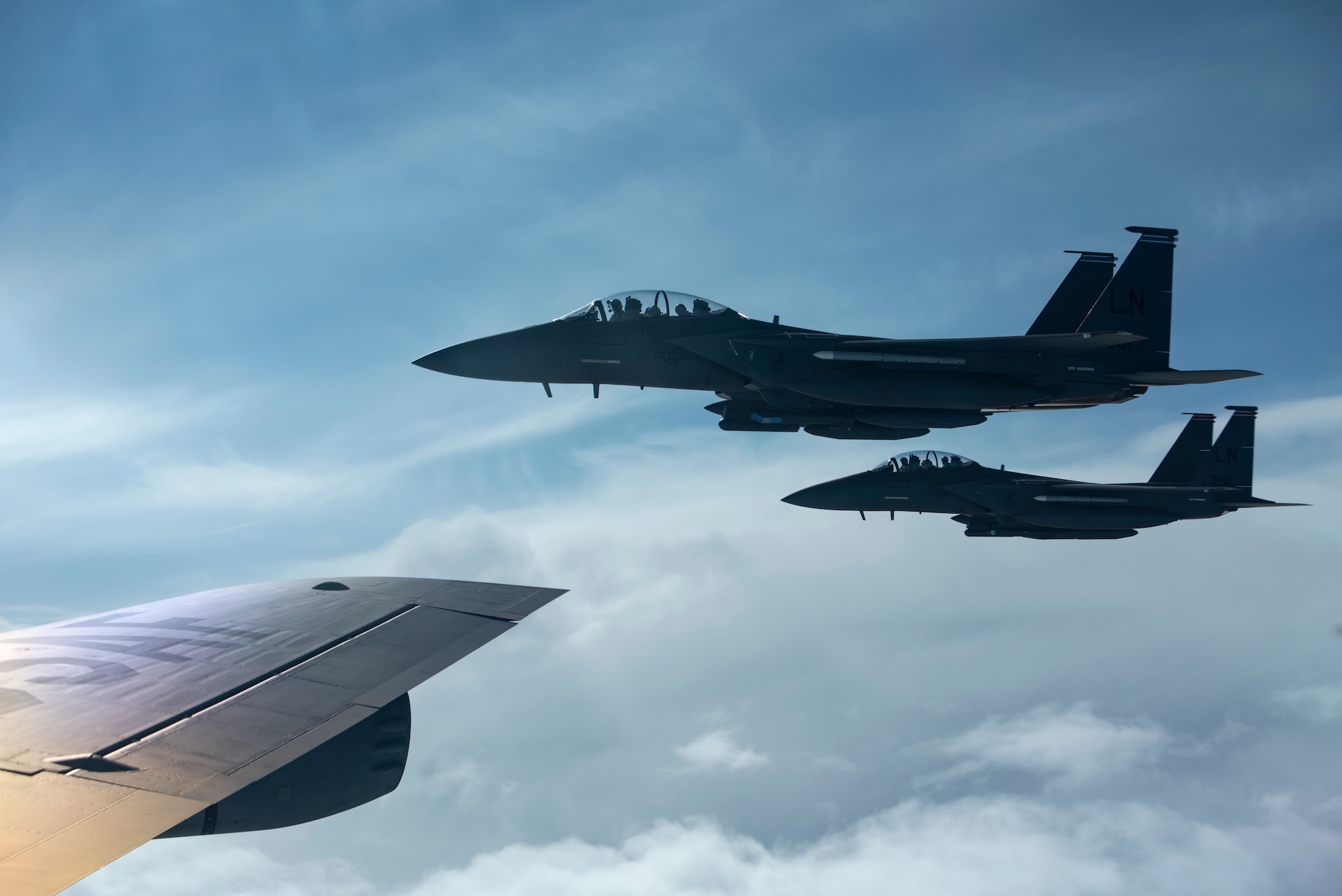 F-15E Strike Eagles assigned to the 492nd Fighter Squadron fly beside a KC-135 Stratotanker assigned to the 100th Air Refueling Wing on the way to Amari Air Base, Estonia, in support of Exercise Baltic Trident, March 15, 2021. Incorporating Agile Combat Employment concepts into exercises like Baltic Trident increases lethality and enhances interoperability with NATO allies and partner nations, ensuring the ability to counter military aggression and coercion by sharing responsibilities for common defense. (U.S. Air Force photo by Airman 1st Class Jessi Monte)