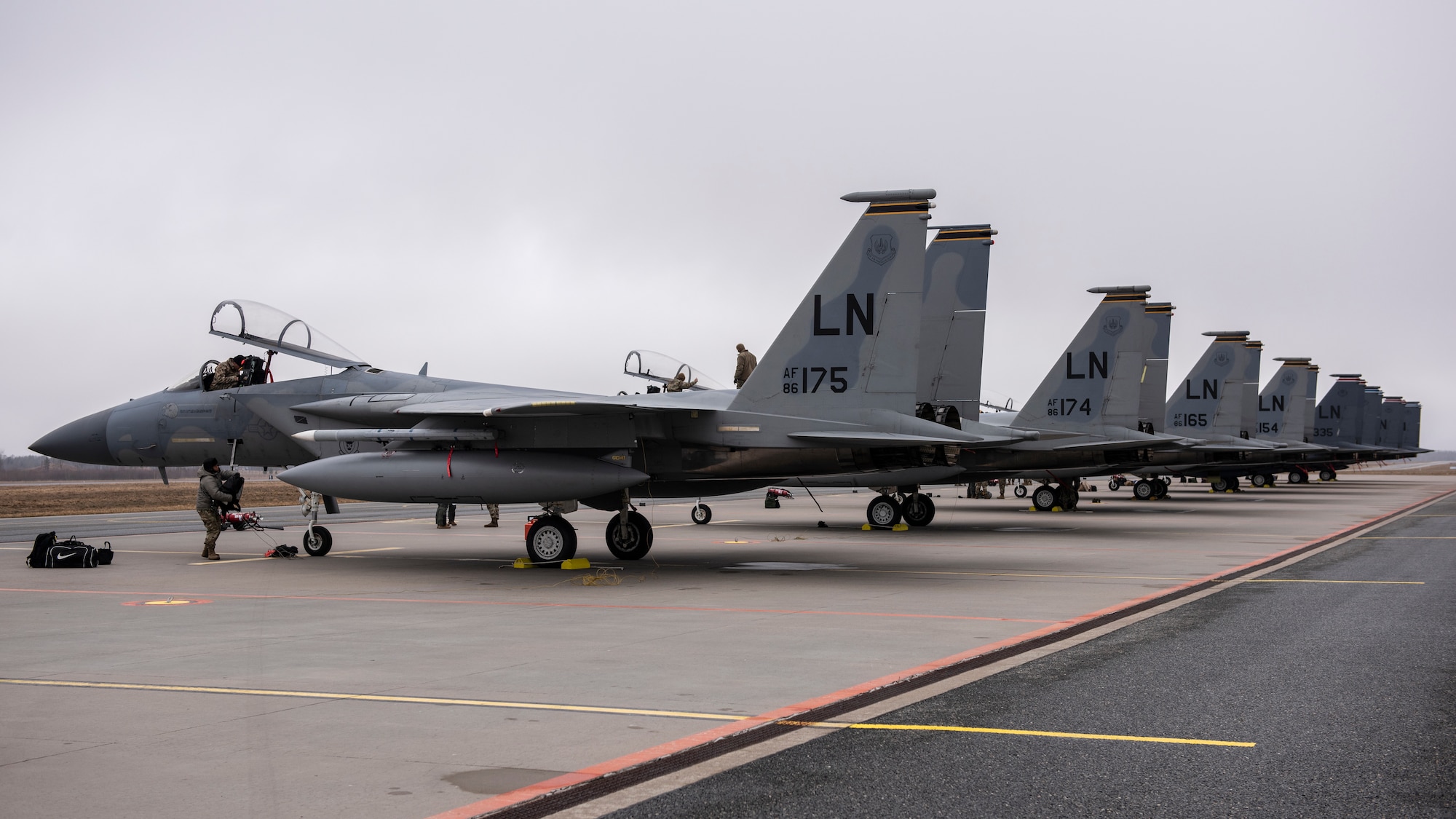 F-15C Eagles and F-15E Strike Eagles from the 48th Fighter Wing line the apron at Amari Air Base, Estonia, in support of Exercise Baltic Trident, March 15, 2021. Incorporating Agile Combat Employment concepts into exercises like Baltic Trident increases lethality and enhances interoperability with NATO allies and partner nations, ensuring the ability to counter military aggression and coercion by sharing responsibilities for common defense. (U.S. Air Force photo by Airman 1st Class Jessi Monte)