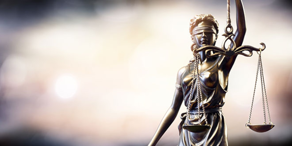 Statue of Lady Justice. Stock Photo © iStock.com/RomoloTavani