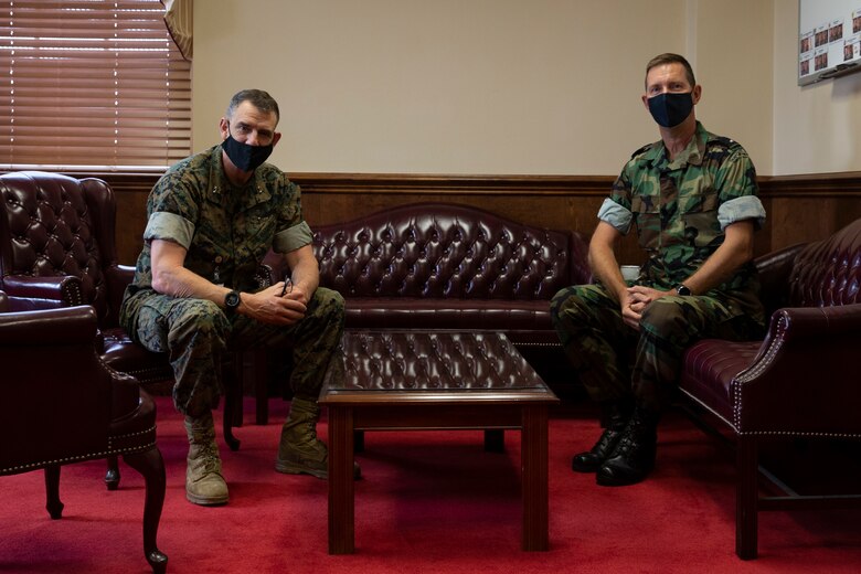 Netherlands Marine Corps Brig. Gen. Frank Boots, director of the Dutch Caribbean Coastguard and Commander of Component Task Group 4.4, right, poses for a photo with U.S. Marine Corps. Maj. Gen. Francis Donovan, Commanding General of 2d Marine Division, on Camp Lejeune, N.C., March 18, 2021. Dutch Marine leadership visited the Marines of 32nd Raiding Squadron during Exercise Caribbean Urban Warrior. The exercise is designed to increase global interoperability between 2d Reconnaissance Battalion, 2d Marine Division and 32nd Raiding Squadron, Netherlands Marine Corps. (U.S. Marine Corps photo by Pfc. Sarah Pysher)