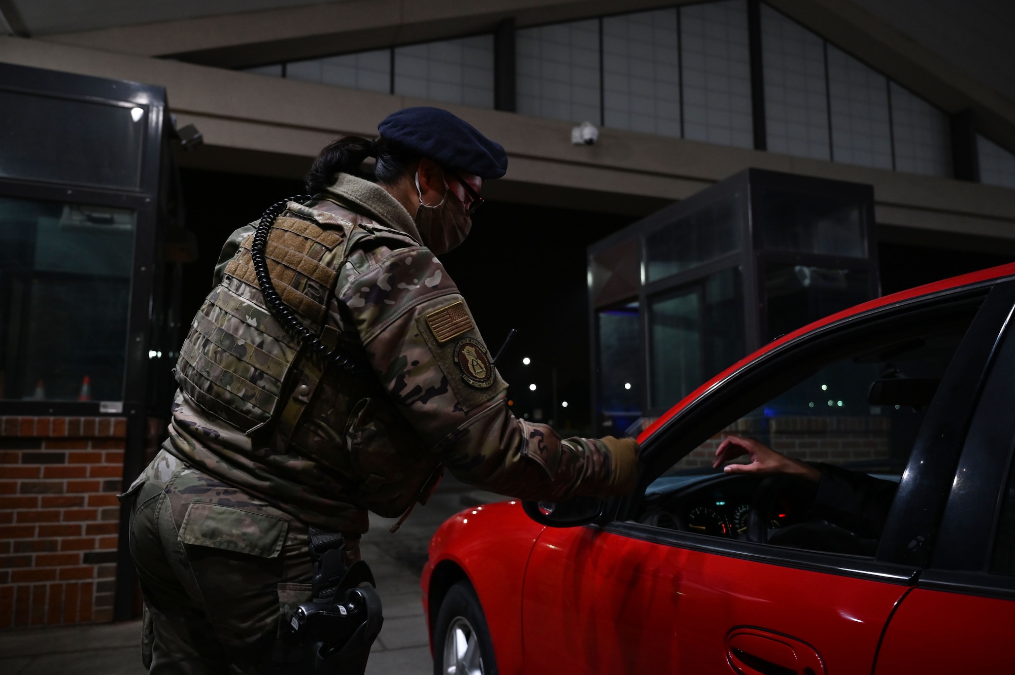 Airman 1st Class Maria Nunez, 375th Security Forces Squadron entry controller, scans a common access card, March 16, 2021, at the Shiloh Gate on Scott Air Force Base, Il. Nunez has been in the Air Force for a year and describes herself as a people person. (U.S. Air Force photo by Senior Airman Dalton Williams)