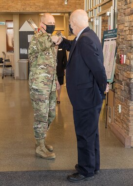 NRO Deputy Director Maj. Gen. Michael Guetlein elbow bumps Acting Secretary of the Air Force John Roth upon his arrival to Aerospace Data Facility Colorado March 11, 2021. During his visit, Roth got a firsthand look at how NRO operations stay mission-ready through the capabilities of airmen and assets at the ADF-C. He spoke with airmen, soldiers, and sailors on the operations watch floor for a broader understanding of the collaboration required to provide data to defense, intelligence, and civil agencies supporting the U.S. Government and its allies.