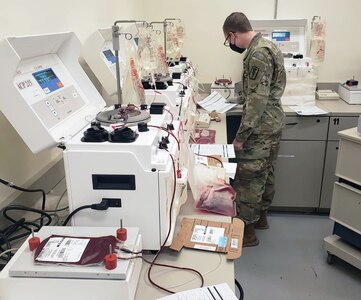 Spc. Raymond Torrissi, with the 95th Medical Detachment-Blood Support, reviews quality assurance documents required for the blood deglycerolization process at Camp Humphreys, South Korea. (Photo Credit: Sgt. Tao McCarthy)