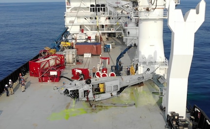 An MH-60S on deck of contracted salvage vessel off the coast of Yokosuka, Japan on March 18, 2021, having just been pulled from the depth of 19,075 ft by NAVSEA Supervisor of Salvage and Diving, (SUPSALV) at the request of the Navy Safety Center to facilitate accident investigation.