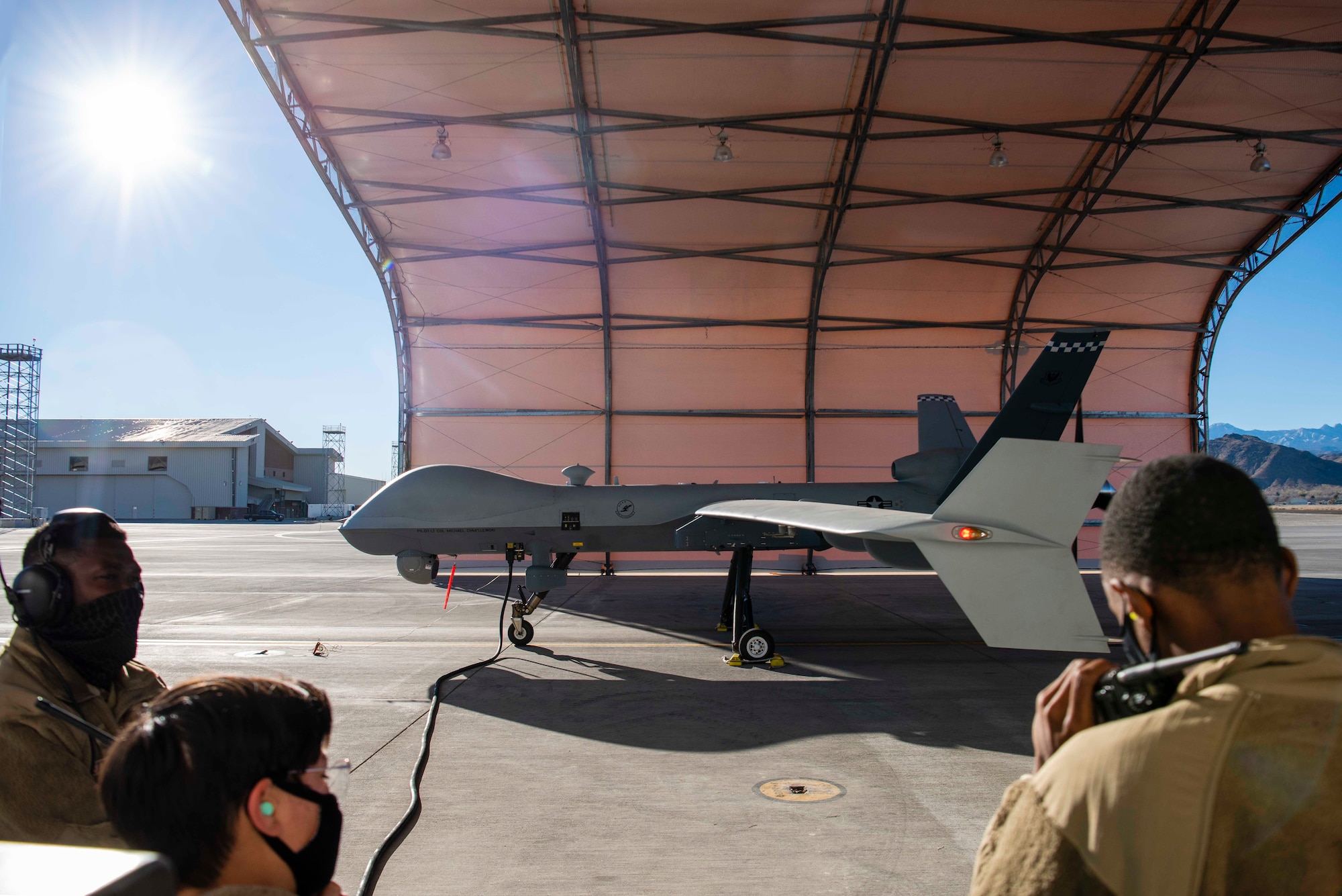 Maintainers oversee pre-flight checks.