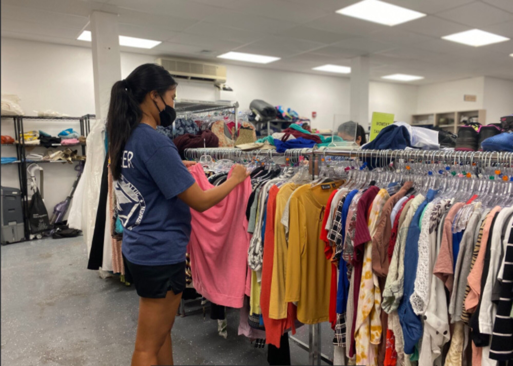 Airman 1st Class Venice Dizon, 15th Comptroller Squadron financial operations technician, works to sort and display donated clothing at the Hickam Airman’s Attic during a volunteer event at Joint Base Pearl Harbor-Hickam, Hawaii, March 10, 2021. The Hickam Airman’s Attic is a facility dedicated for junior enlisted airmen and their families to shop from a plethora of free donated goods ranging from baby supplies to military uniforms. (Courtesy Photo)