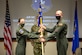 Major Jacob C. Johnson, the new commander of Detachment 3 Air Mobility Command Test and Evaluation Squadron, receives the unit guidon from Lt. Col. Maryann Karlen, AMC TES commander, during an Assumption of Command ceremony March 15, at Edwards Air Force Base, California. (Air Force photo by Senior Master Sgt. Alexander Berry)