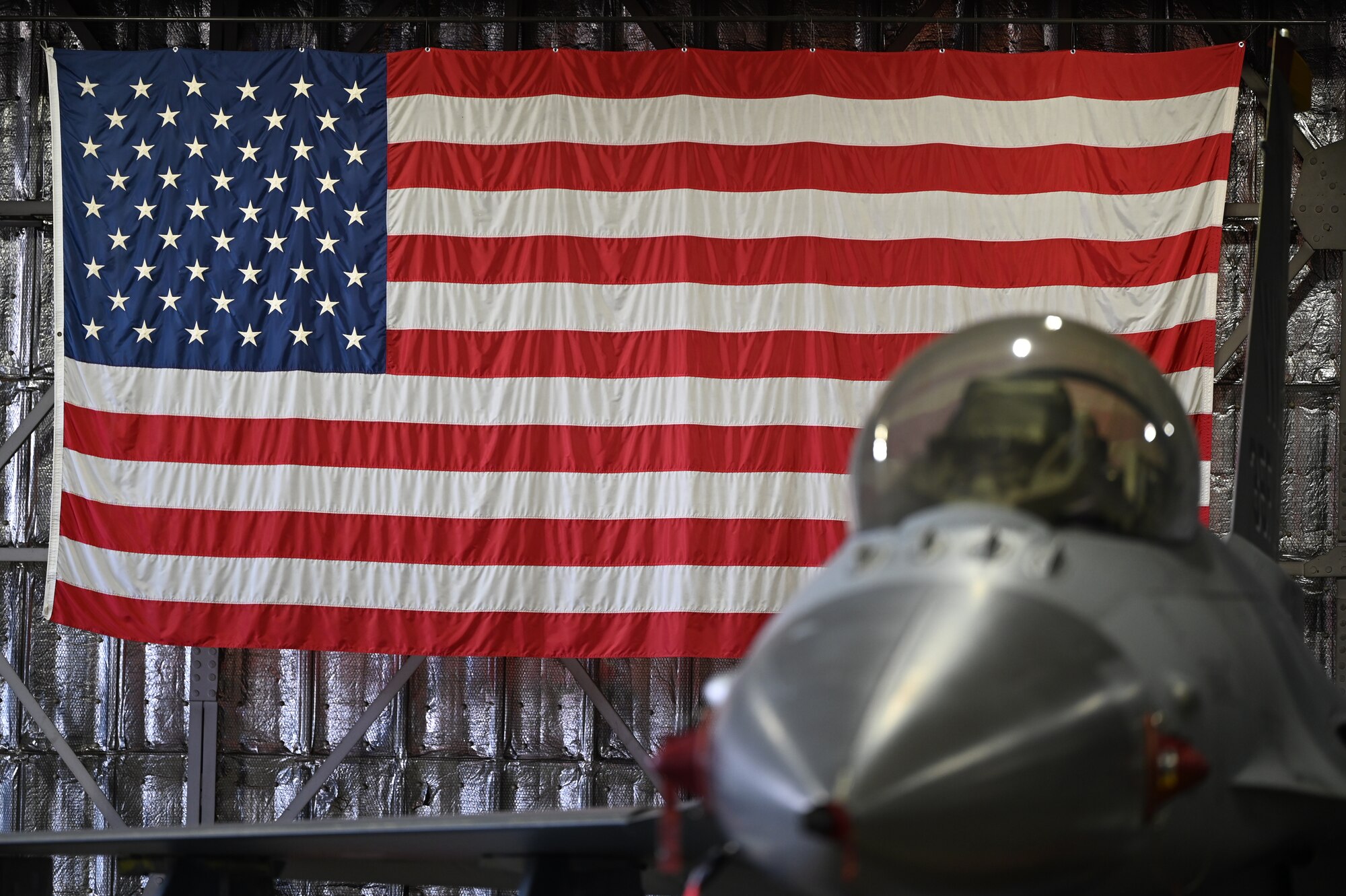 A U.S. Air Force F-16 Fighting Falcon sits in the hangar prior to the 35th Aircraft Maintenance Squadron’s fourth quarter load competition at Misawa Air Base, Japan, Mar. 19, 2021.