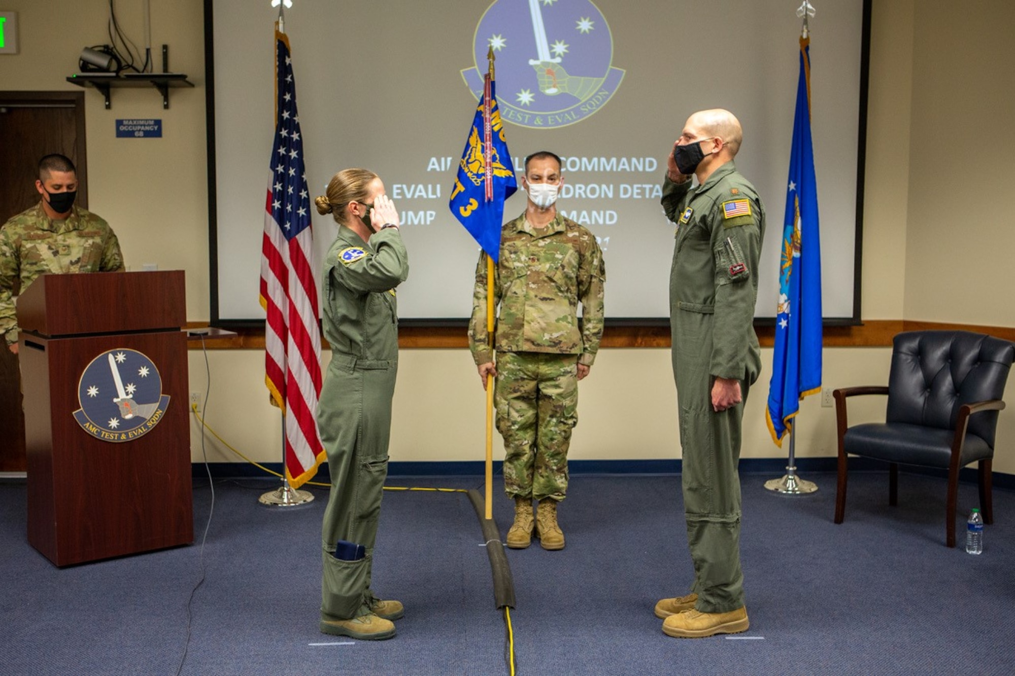 Major Jacob C. Johnson, the new commander of Detachment 3 Air Mobility Command Test and Evaluation Squadron, salutes Lt. Col. Maryann Karlen, AMC TES commander, during an Assumption of Command ceremony March 15, at Edwards Air Force Base, California. (Air Force photo by Senior Master Sgt. Alexander Berry)