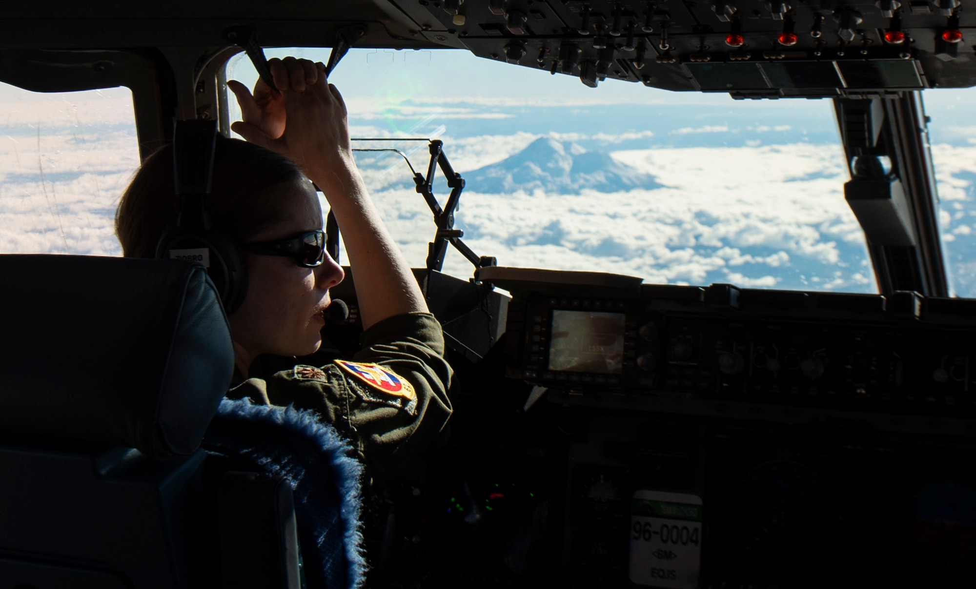 U.S. Air Force Maj. Celine Ziobro, 7th Airlift Squadron C-17 Globemaster III instructor pilot, participates in a training flight near Joint Base Lewis-McChord, Washington, Dec. 14, 2020. Ziobro, along with other Team McChord Airmen, participated in an all-female mission to honor women in the Air Force. (U.S. Air Force photo by Senior Airman Tryphena Mayhugh)