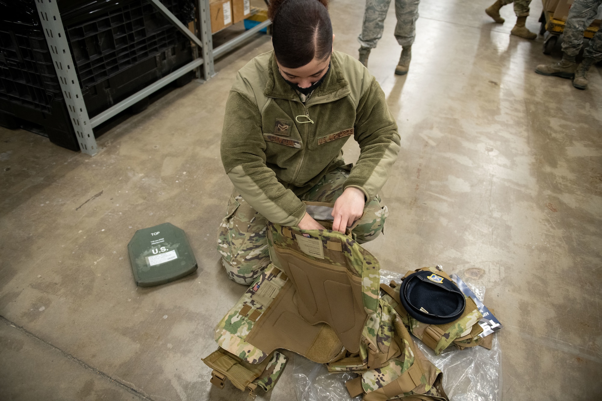 Airman 1st Class Rodaysha Canton, a 28th Security Forces Squadron response force leader, places protective plates inside the Aspetto Mach V Female Body Armor (FBA) system she was issued at Ellsworth Air Force Base, S.D., March 2, 2021. This addition of female body armor came as part of the Reconstitute Defender Initiative, a comprehensive effort for the Air Force launched by former Air Force Chief of Staff Gen. David Goldfein to revitalize and reconfigure security forces squadrons. (U.S. Air Force photo by Staff Sgt. Hannah Malone)