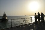 Sailors assigned to guided-missile cruiser USS Philippine Sea (CG 58) prepare to depart Manama, Bahrain, during a sea and anchor detail, March 21. Philippine Sea is deployed to the U.S.  5th Fleet area of operations in support of naval operations to ensure maritime stability and security in the Central Region, connecting the Mediterranean and Pacific through the western Indian Ocean and three critical chokepoints to the free flow of global commerce.