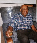 Robert (Bob) O’Neil, Tuskegee Airman World War II fighter pilot, relaxes on a couch in a home. The Tuskegee Airmen were the first Black military aviators in the Army Air Corps and they flew more than 15,000 individual sorties in Europe and North Africa during World War II. O’Neil passed away from cancer in 2002 at the age of 80, more than 57 years after the end of WWII. (Courtesy Photo)