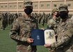 Norwegian Army 1st Lt. Havard Boge fist bumps Army Reserve Brig. Gen. Justin Swanson, the commanding general of the 310th Sustainment Command (Expeditionary) during the March 21, 2021 recognition ceremony at Camp Arifjan, Kuwait, for the 328 U.S. and coalition military personnel who earned the Norwegian Foot March badge. Boge, who represented the Norwegian Army at the ceremony, finished 18.6-mile course with a 25-pound ruck with the second fastest time when he crossed the finish line at 2 hours and 54 minutes. (U.S. Army photo by Staff Sgt. Neil W. McCabe)