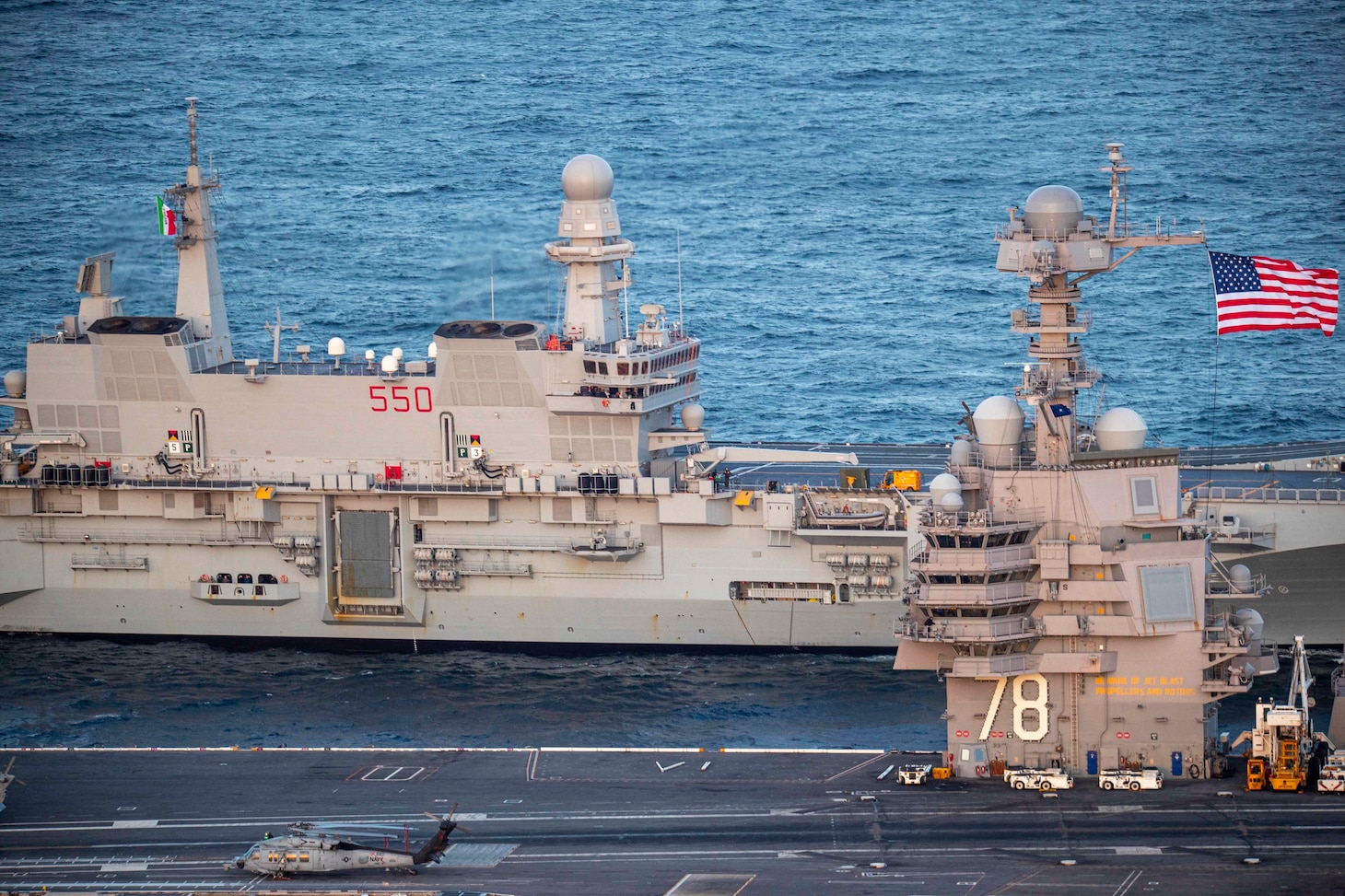 USS Gerald R. Ford (CVN 78) and the Italian navy aircraft carrier ITS Cavour (CVH 550) transit the Atlantic Ocean.
