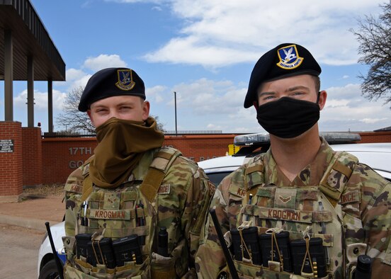 U.S. Air Force Airman 1st Class Damian Krogman and Airman 1st Class Brandon Krogman, 17th Security Forces Squadron installation entry controllers, are two brothers who work the same job, during the same shift and at the same gate, at the South Gate on Goodfellow Air Force Base, Texas, March 16, 2021. The Krogman’s relationship extinguished any fear of turmoil or repercussion for holding one another accountable on and off the duty, as taught in Air Force values. (U.S. Air Force photo by Senior Airman Abbey Rieves)