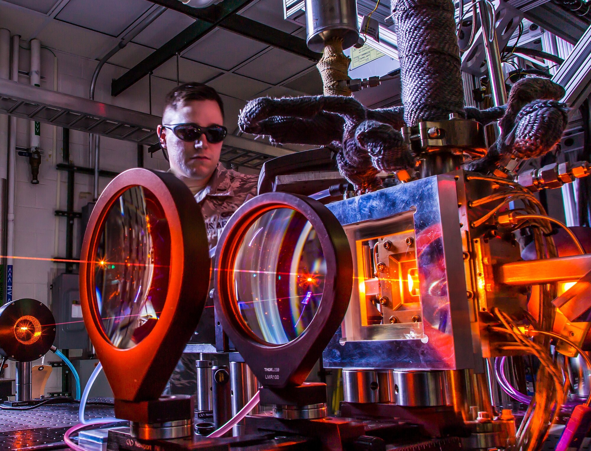 An Air Force Research Laboratory Directed Energy Directorate laser physicist analyzes the output beam from one of the directorate’s advanced laser sources. AFRL scientists investigate novel laser sources that are easily maintained, environmentally friendly, and capable of high power levels. Benefits of directed energy for the warfighter include speed of light delivery, long-range engagement, low collateral damage and deep magazine. (Courtesy photo)