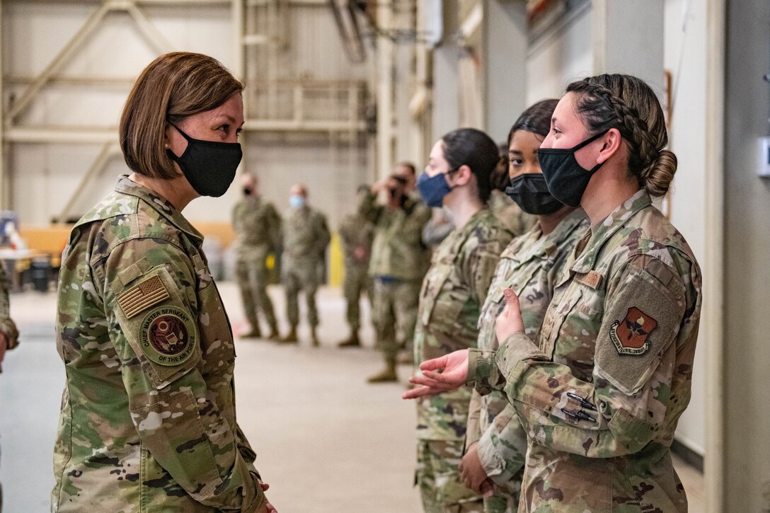 Chief Master Sergeant of the Air Force JoAnne S. Bass speaks to Airman 1st Class Brianna Cortez, 97th Logistics Readiness Squadron material manager, March 22, 2021, at Altus Air Force Base, Okla. During her visit, Bass learned about the cultures of multiple squadrons across the wing and how it enables them to deliver elite airpower, including those responsible for providing premier C-17 Globemaster III, KC-135 Stratotanker and KC-46 Pegasus aircrew training worldwide.