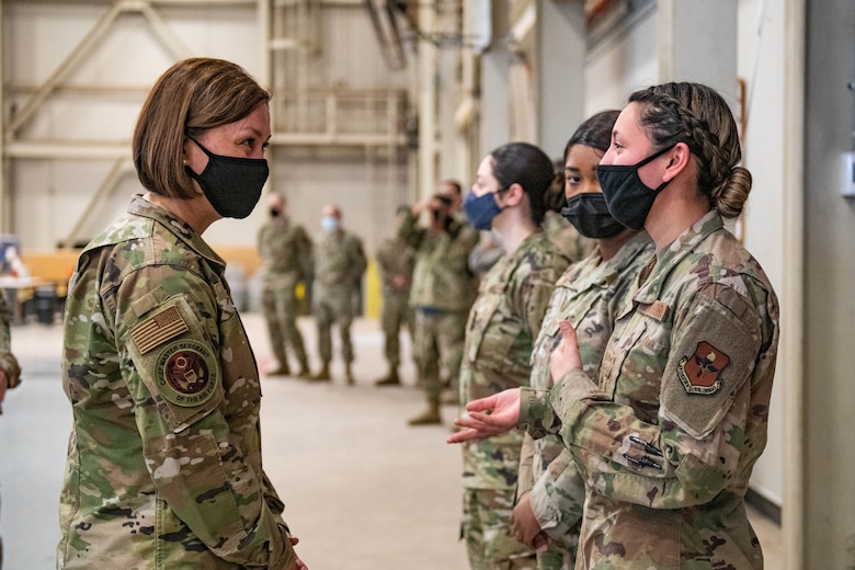 Chief Master Sergeant of the Air Force JoAnne S. Bass speaks to Airman 1st Class Brianna Cortez, 97th Logistics Readiness Squadron material manager, March 22, 2021, at Altus Air Force Base, Okla. Bass visited Airmen responsible for providing premier C-17 Globemaster III, KC-135 Stratotanker and KC-46 Pegasus aircrew training worldwide.