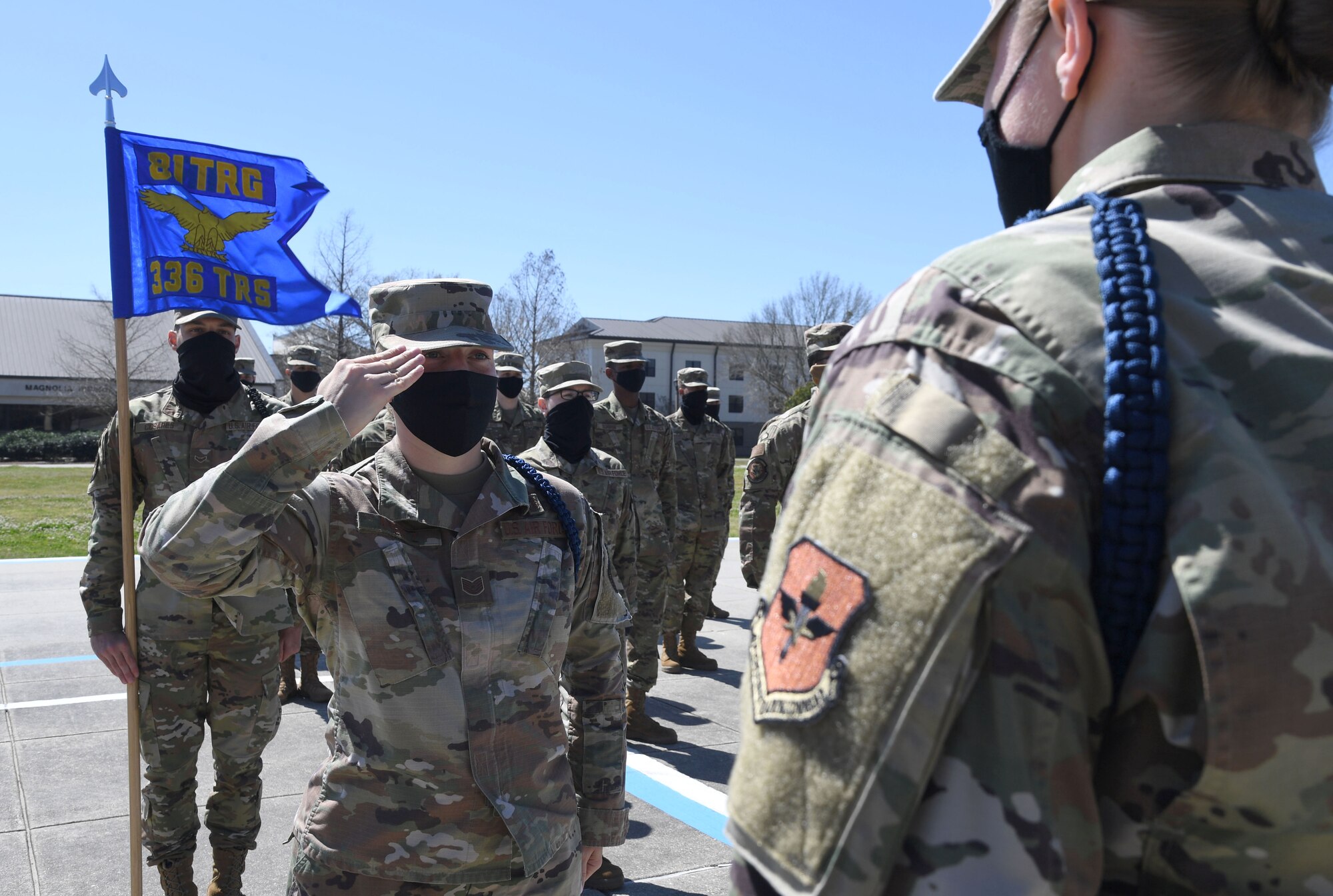U.S. Air Force Tech. Sgt. Dynasty Arentz, 336th Training Squadron military training leader, renders a salute prior to conducting an open ranks inspection on the drill pad at Keesler Air Force Base, Mississippi, March 9, 2021. The Master Military Training Leader Program, created at Keesler, was designed to distinguish the military training leaders who have mastered the demonstration, evaluation and reinforcement of military standards; exude military bearing and discipline while scheduling and conducting military training; and are key leaders among Airmen and their peers. (U.S. Air Force photo by Kemberly Groue)