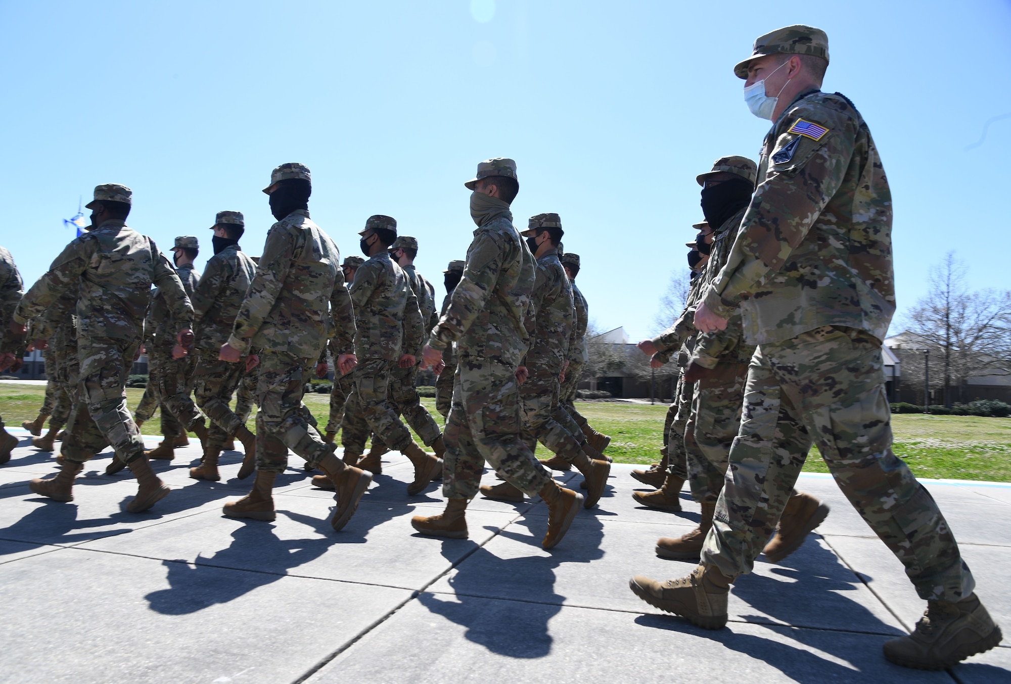 U.S. Air Force Tech. Sgt. Andrew Solito, 338th Training Squadron assistant flight chief, leads a flight in various marching formations on the drill pad at Keesler Air Force Base, Mississippi, March 9, 2021. The Master Military Training Leader Program, created at Keesler, was designed to distinguish the military training leaders who have mastered the demonstration, evaluation and reinforcement of military standards; exude military bearing and discipline while scheduling and conducting military training; and are key leaders among Airmen and their peers. (U.S. Air Force photo by Kemberly Groue)