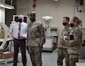 Isaac Newman, left, chief of the U.S. Army Medical Materiel Agency’s Medical Maintenance Operations Division at Tracy, California, briefs leadership from U.S. Army Communications-Electronics Command during a Feb. 24 visit. Pictured with Newman, from left, are Maj. Gen. Mitchell Kilgo, commanding general of CECOM, USAMMA Commander Col. John “Ryan” Bailey and CECOM Command Sgt. Maj. Kristie Brady. (Photo Credit: Jowel A. Liwanag)