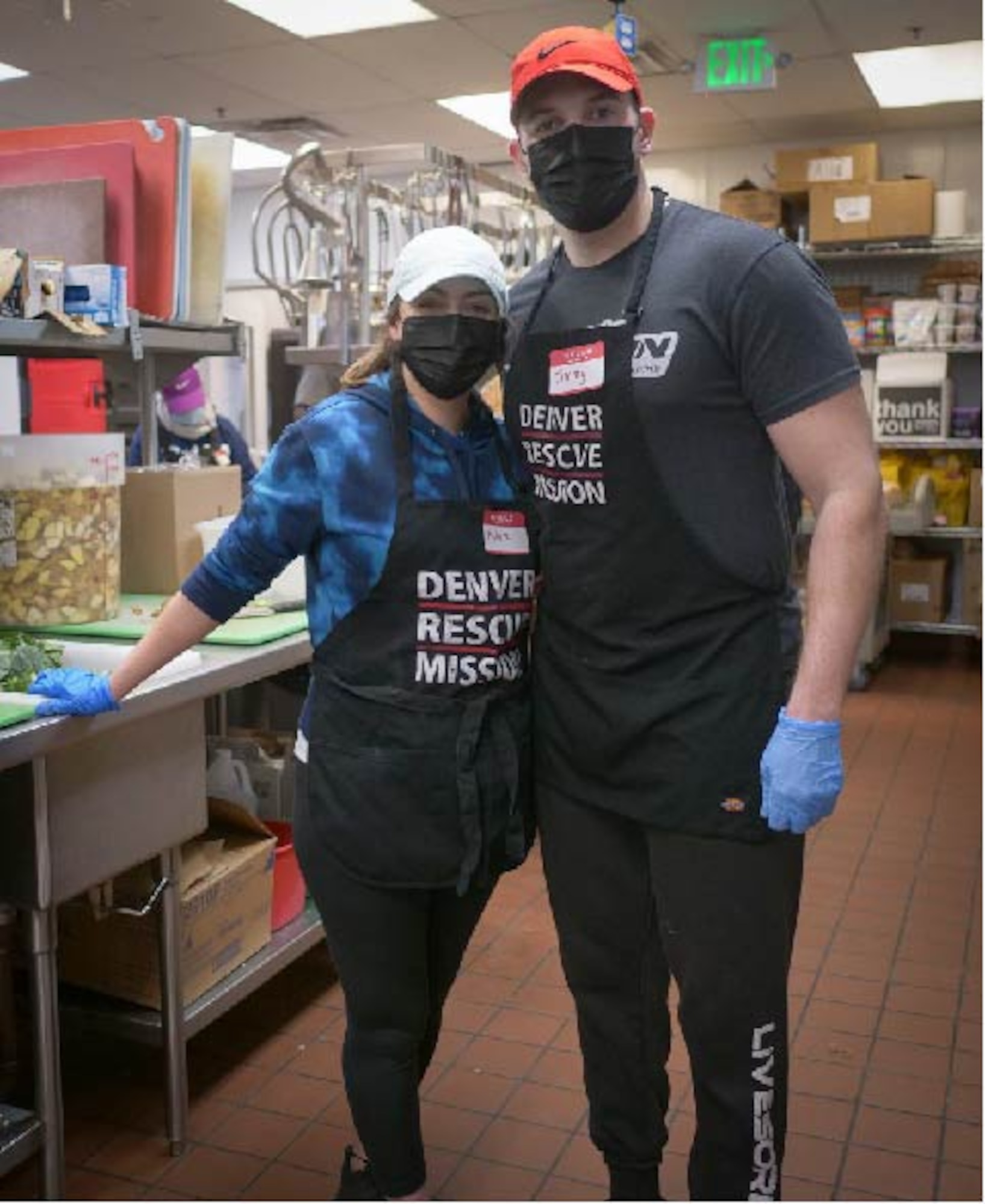 U.S. Air Force Staff Sgt. Jimmy Mrosko, an Air Guard and Reserve assignment technician, and his wife, Staff Sgt. Ashlee Sandefur, a Command Support Staff team member, both at Headquarters Air Reserve Personnel Center, prepares meals at Denver Rescue Mission Feb. 21, 2021, in Denver, Colo. Mrosko led the charge of developing a volunteer team from HQ ARPC in serving the 6,104 homeless persons of the Denver community on a bimonthly basis. (U.S. Air Force photo by Master Sgt. Leisa Grant/Released)