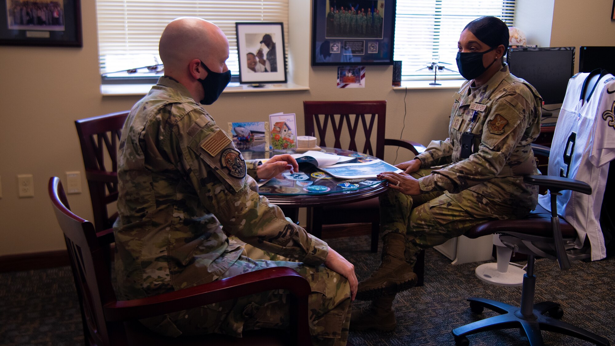 Chief Master Sgt. Melvina Smith, 8th Air Force command chief and Joint Global Strike Operations Center senior enlisted leader and Tech Sgt. Adam Wilkinson, 8th Air Force and Joint Global Strike Operations Center deputy chief of nuclear command, control and communication threats talk through the upcoming day's schedule at Barksdale Air Force base, La., Feb. 23, 2021. Tech Sgt. Wilkinson had the opportunity to shadow Chief Smith for a day. (U.S. Air Force photo by Staff Sgt. Bria Hughes)